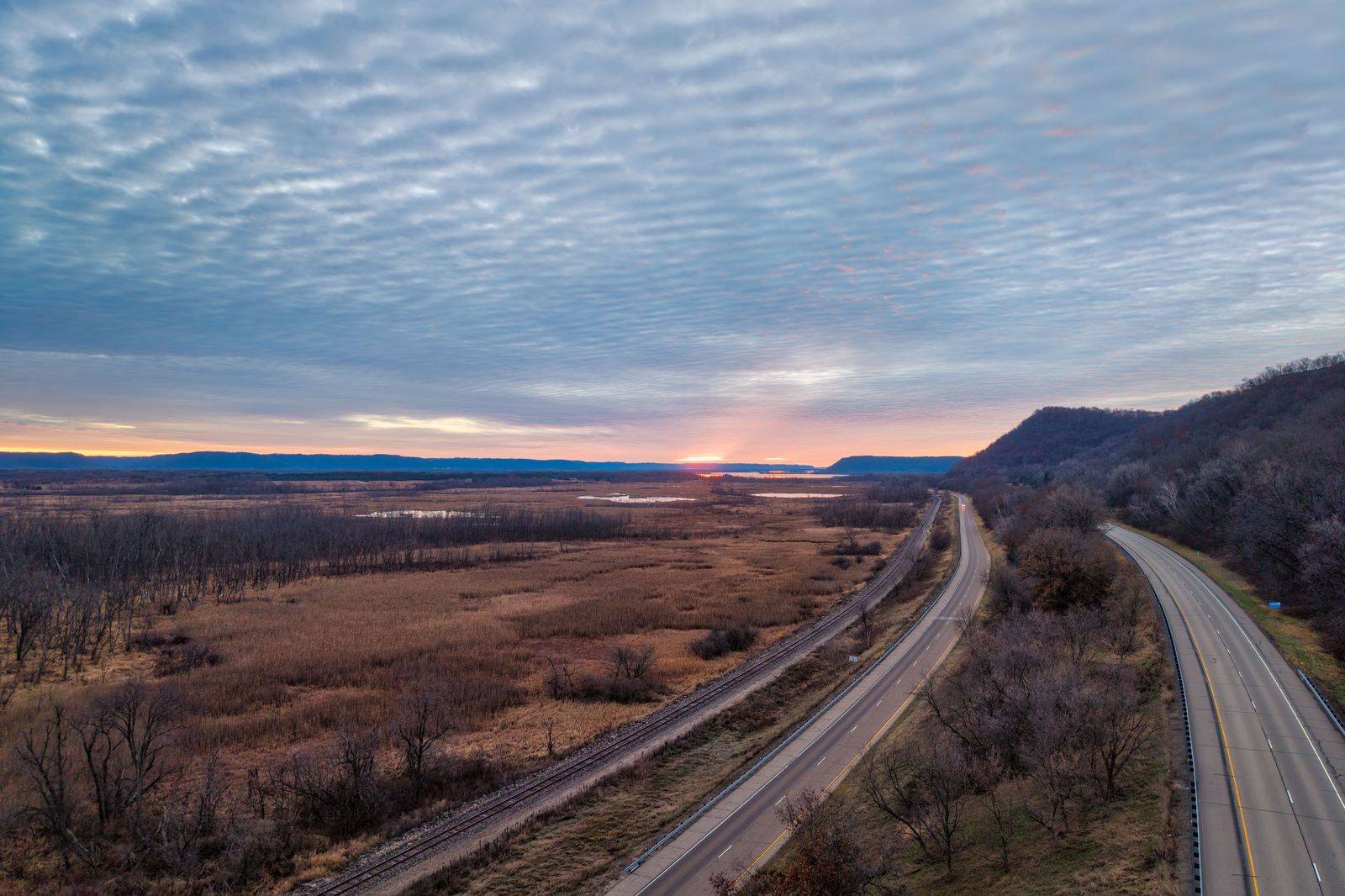 Highway through farmland at dusk on the approach to Hamilton airport in Mount Hope