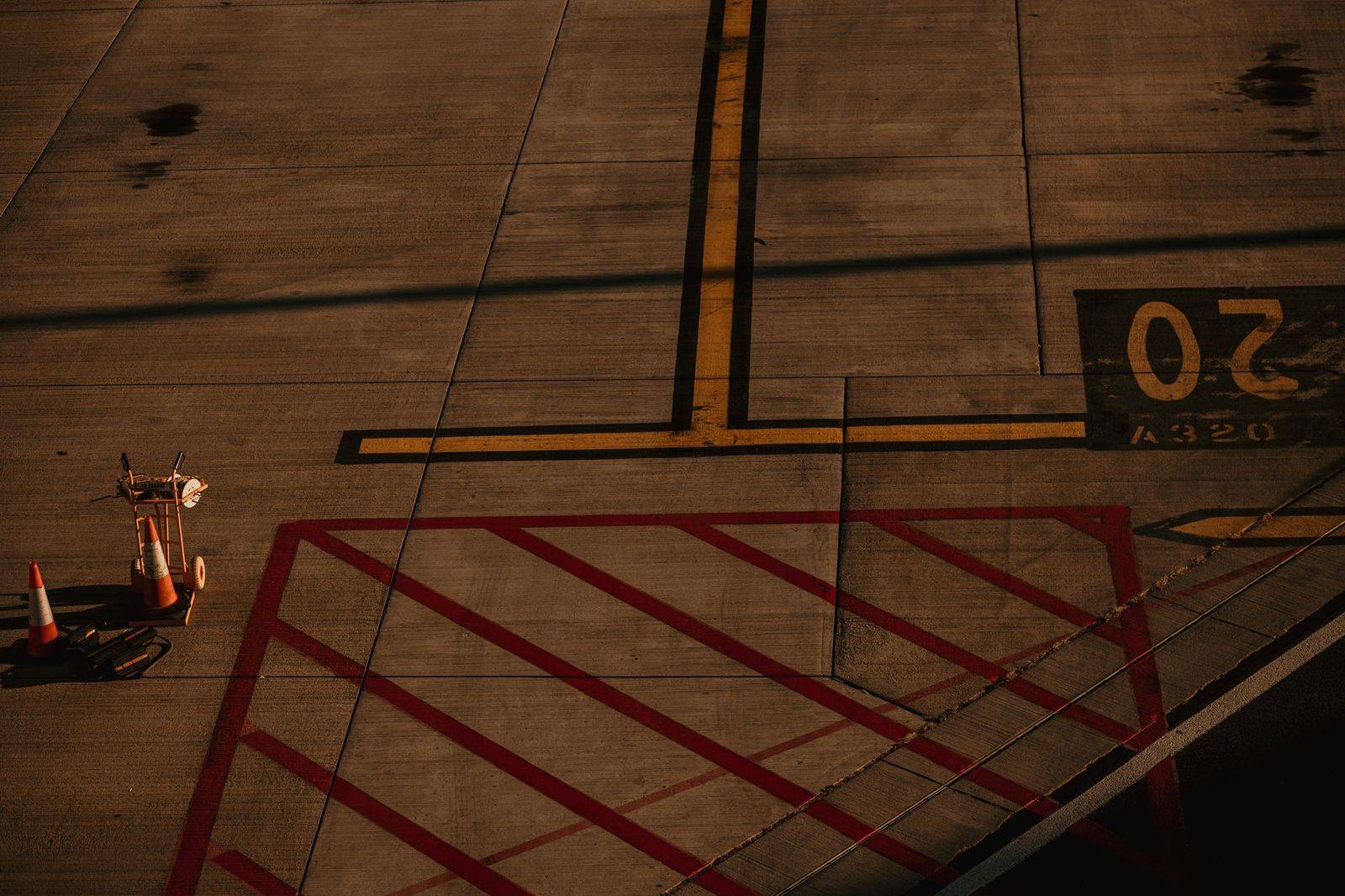 Traveller with a luggage trolley walking through Toronto Pearson arrivals towards the pickup curb