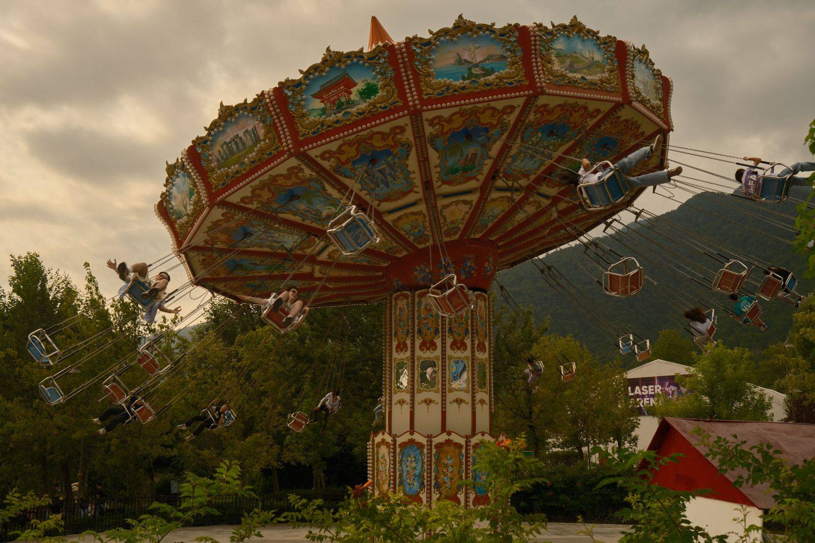 A family on a summer day at a theme park, the kind of long day where a chauffeur for the drive home helps most