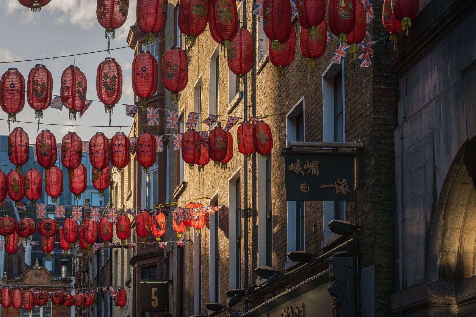 Lanterns and shopfronts on a Chinatown street in Toronto in the evening