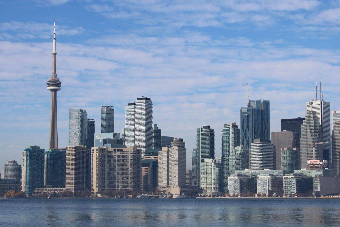 The Toronto skyline lit up at night from the waterfront