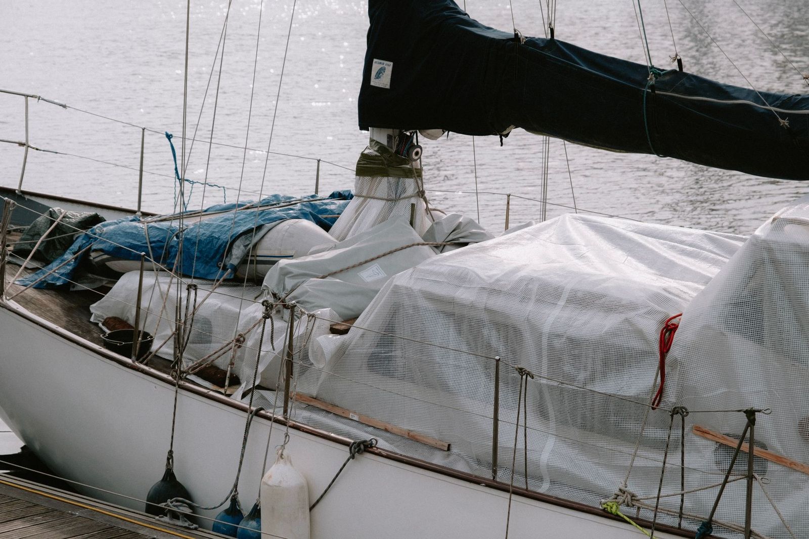 A sailboat deck at a winter marina, the kind of boat buyers compare at the Toronto International Boat Show