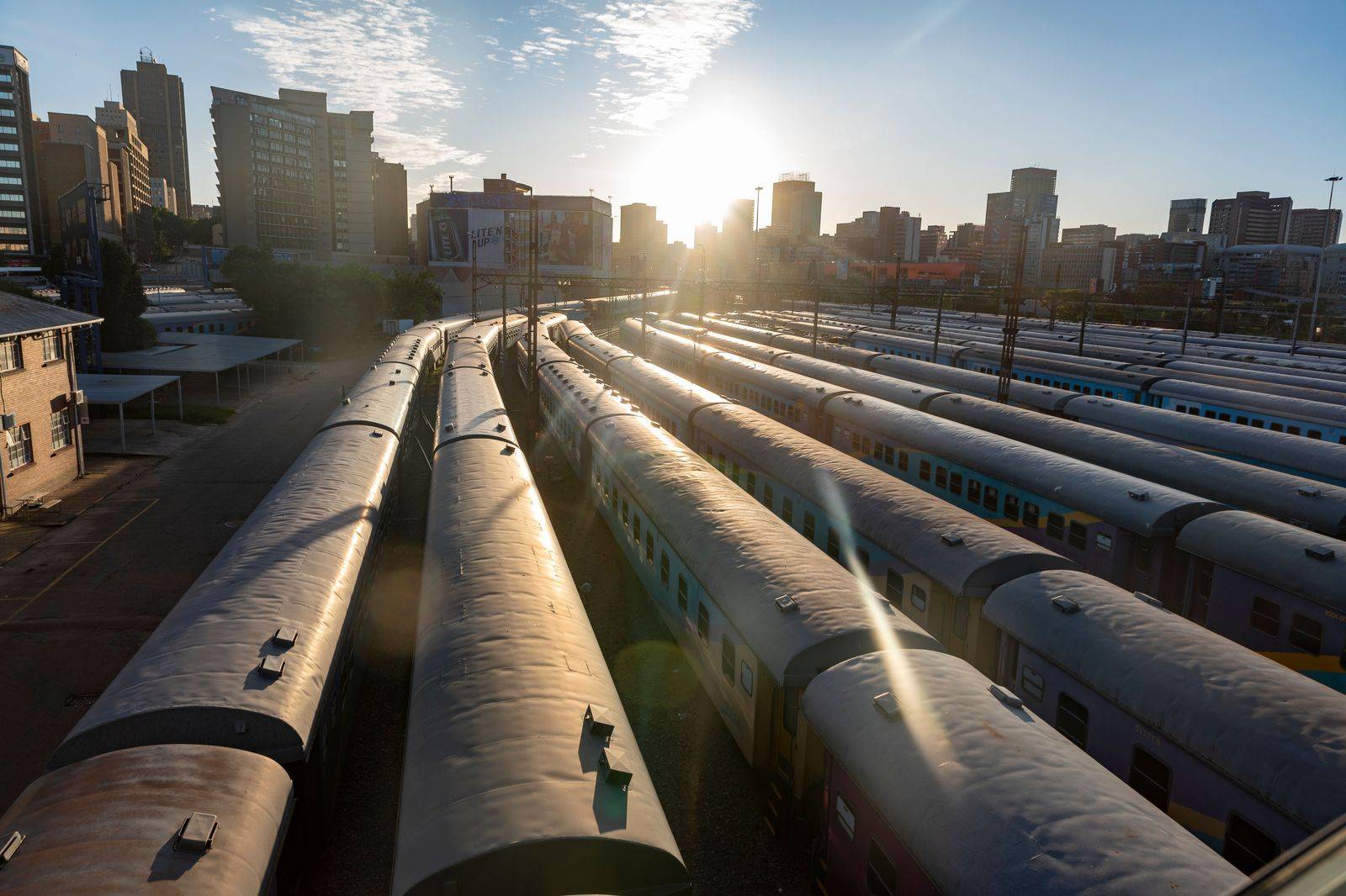 Commuters waiting on a train platform in the morning
