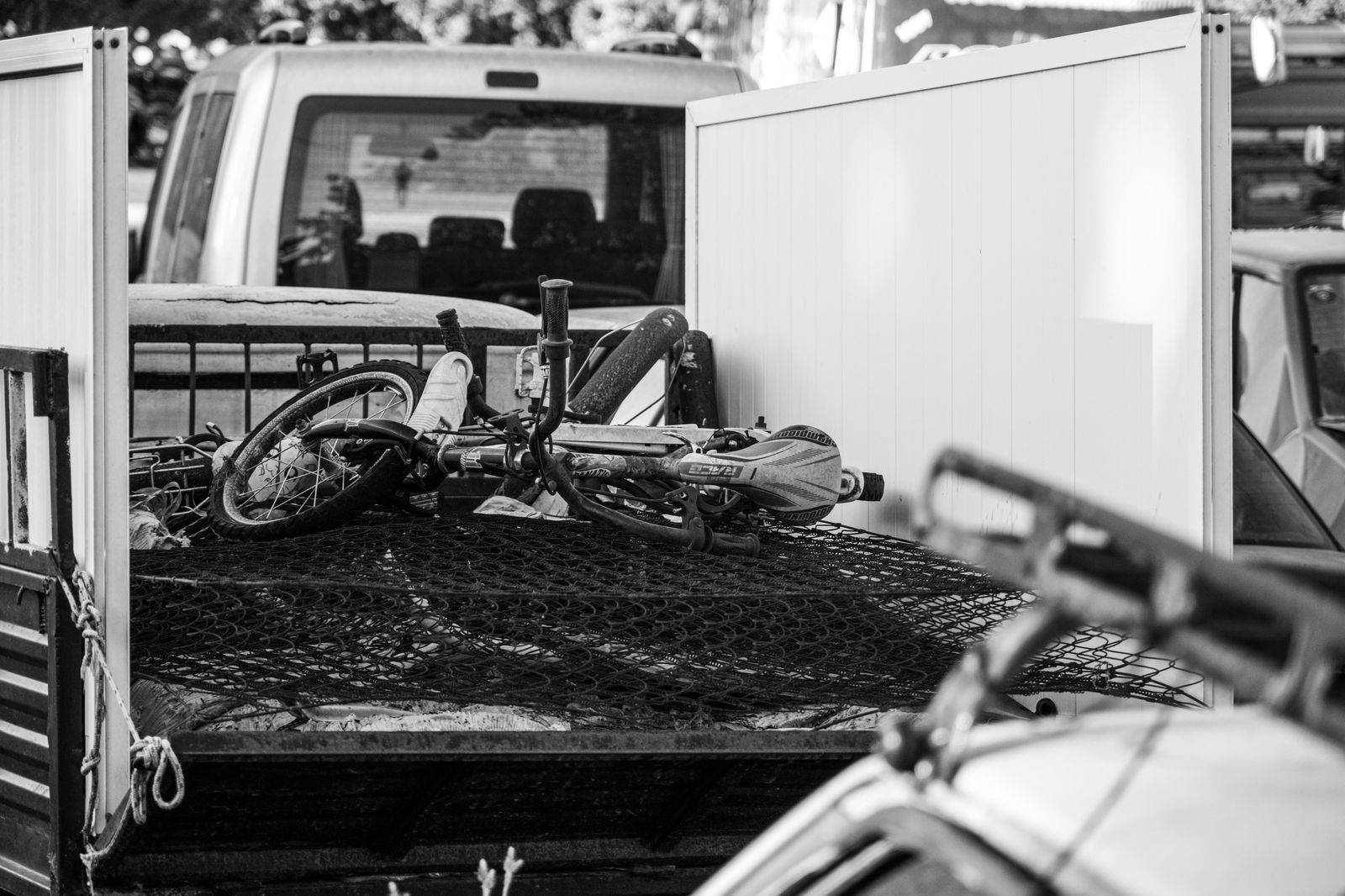 Loading suitcases into the back of an SUV for a long cross-border airport run