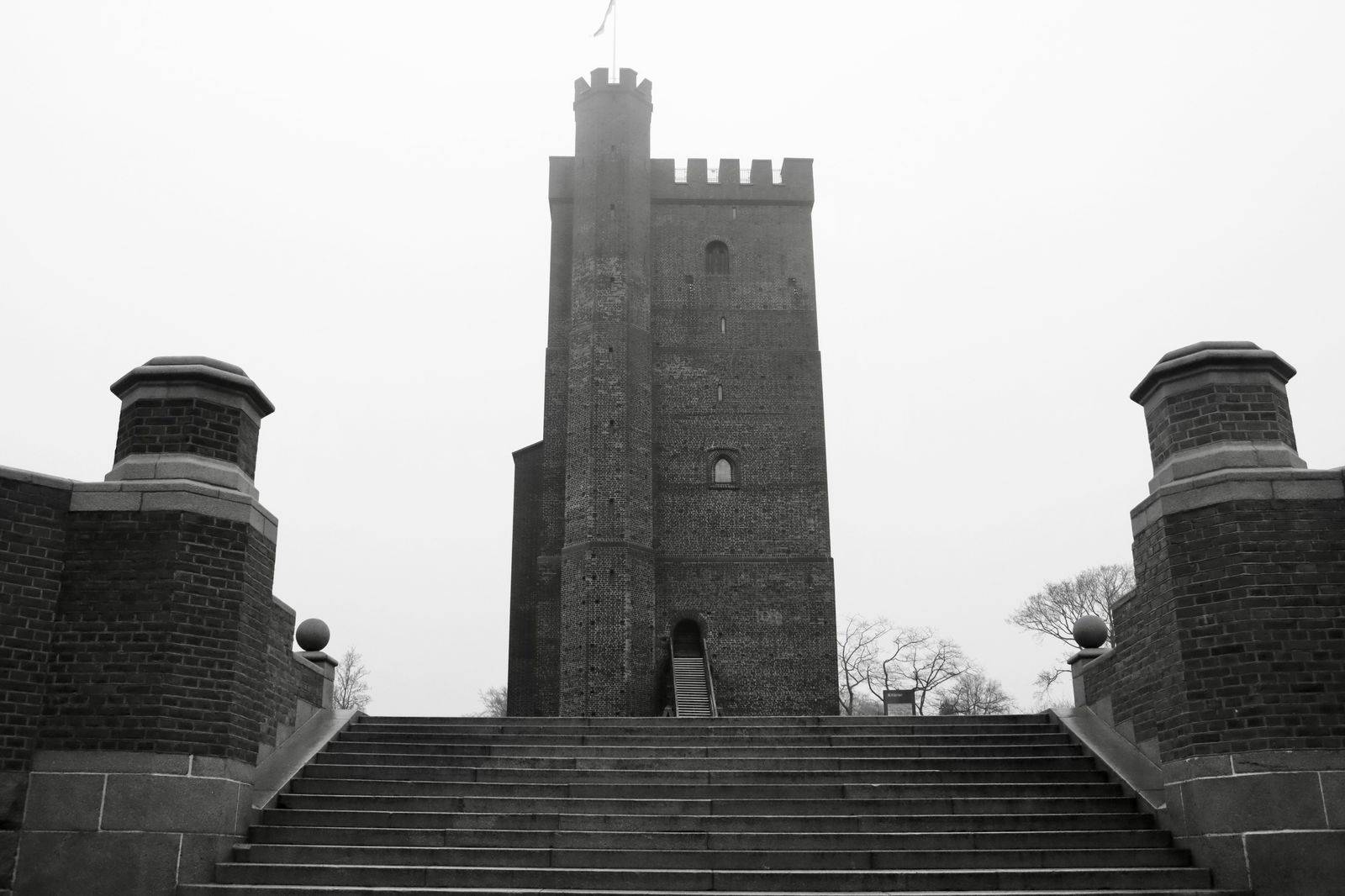 Narrow stone stairs spiralling up inside a castle tower