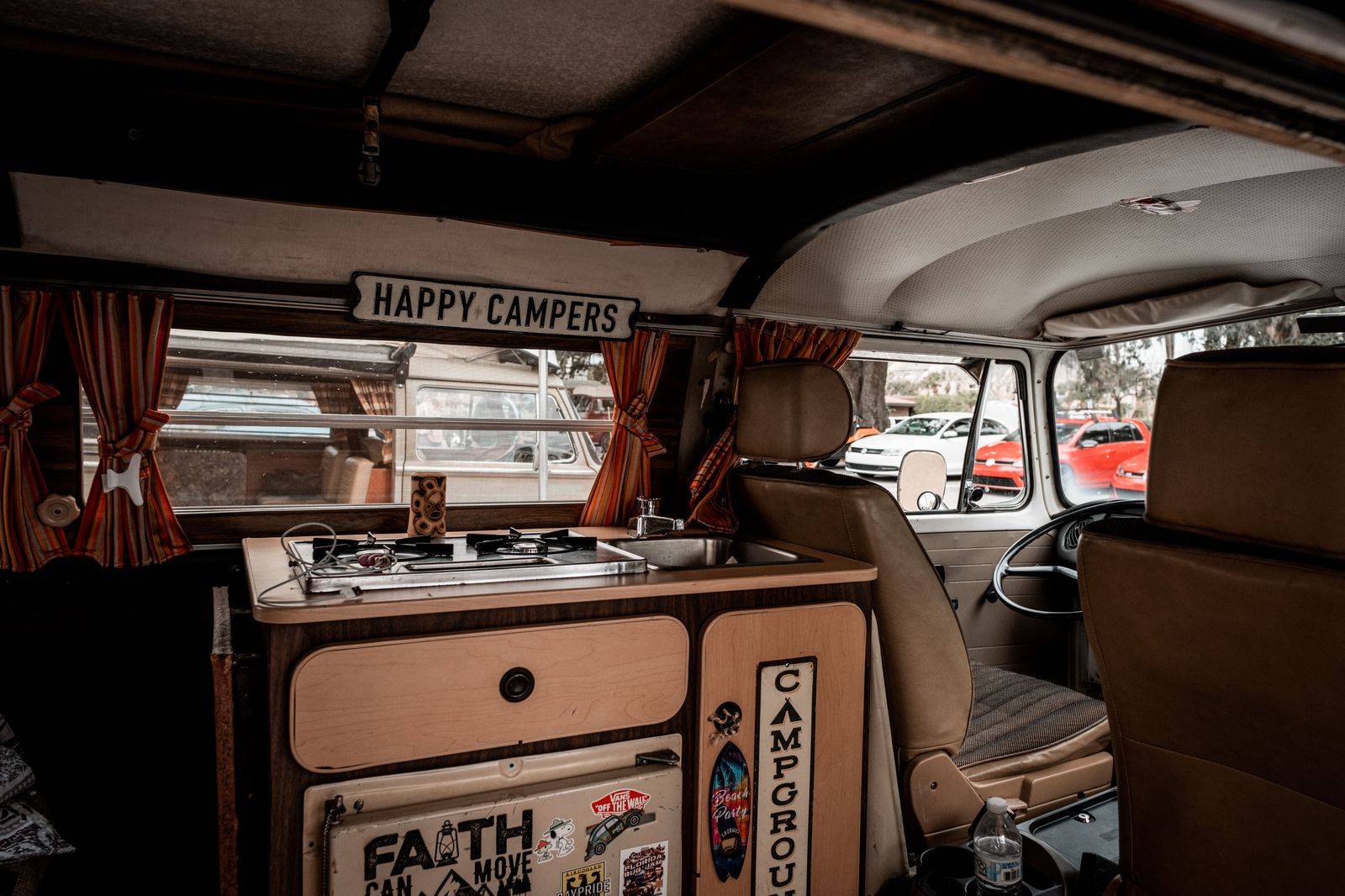 The interior of a luxury van with rows of comfortable seats