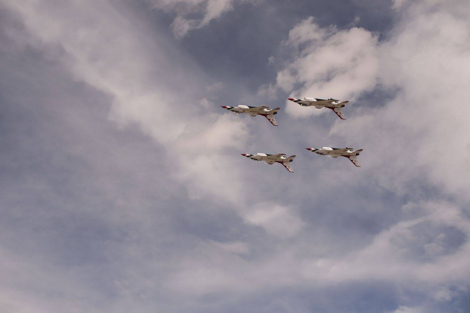 Jets flying in formation over the waterfront during an air show