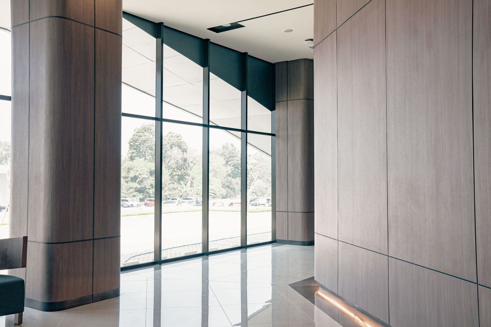 An office tower lobby entrance where a corporate car collects an executive in Toronto
