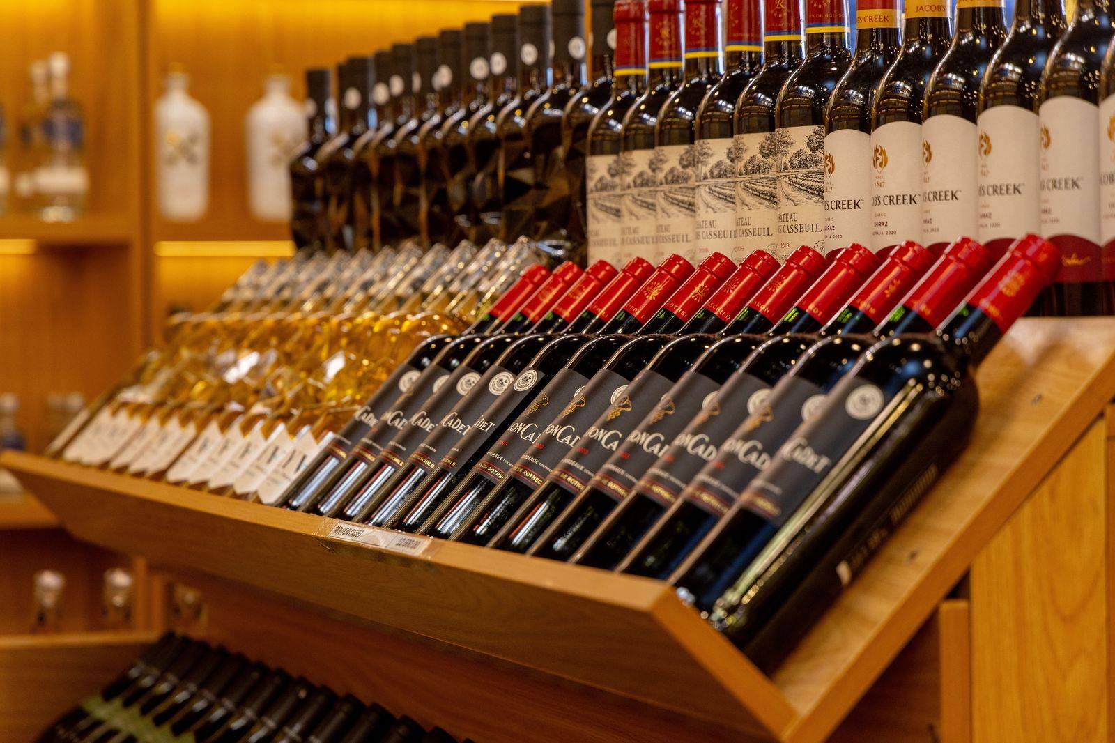 Wine bottles on a store shelf, a common purchase to declare on the drive back to Toronto