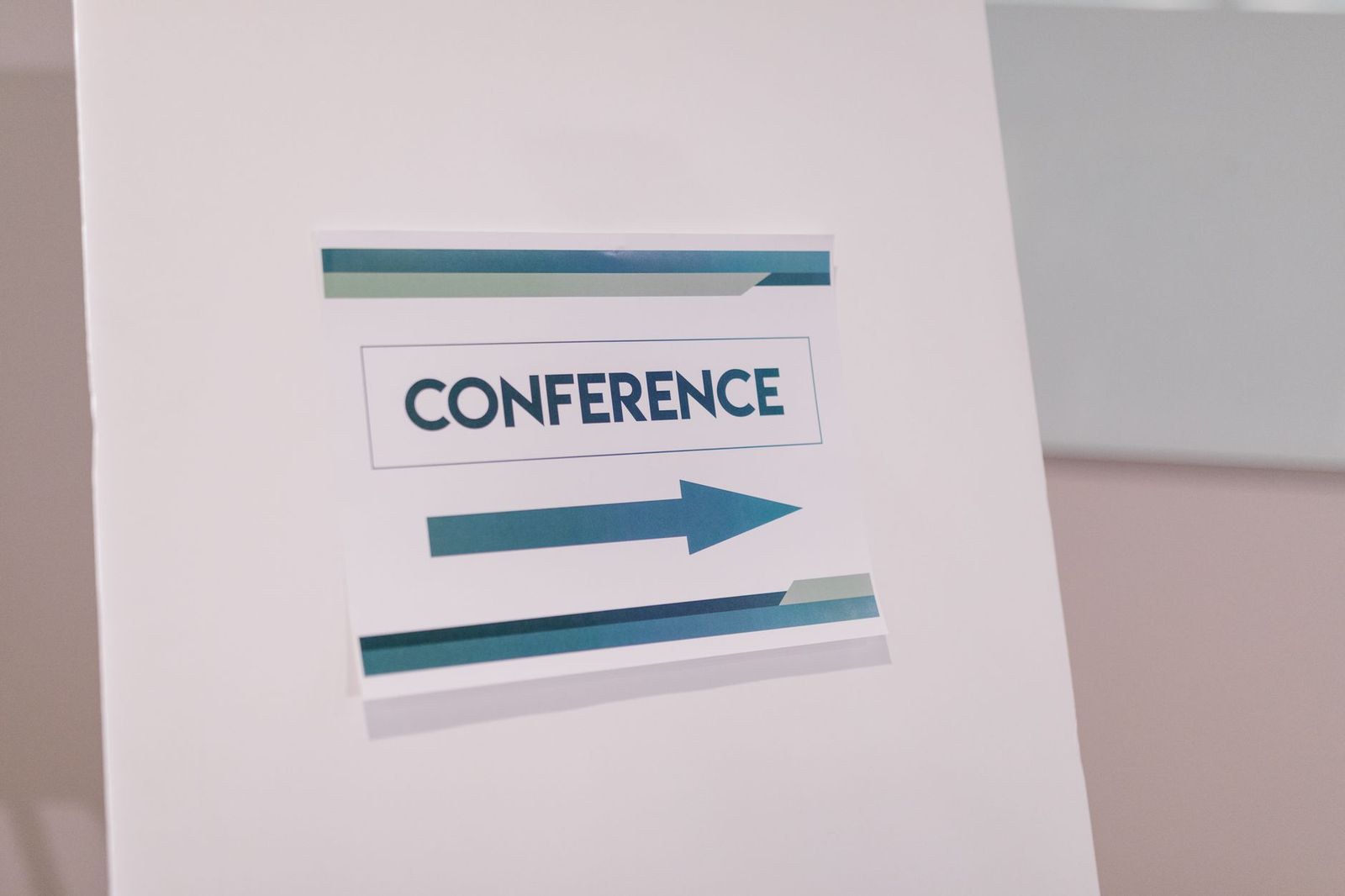 Directional signs point conference delegates to the shuttle stop outside a Toronto hotel