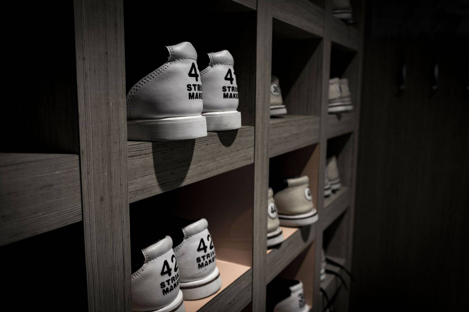 Shoes on display shelves in an outlet store, a common purchase on a Niagara shopping trip