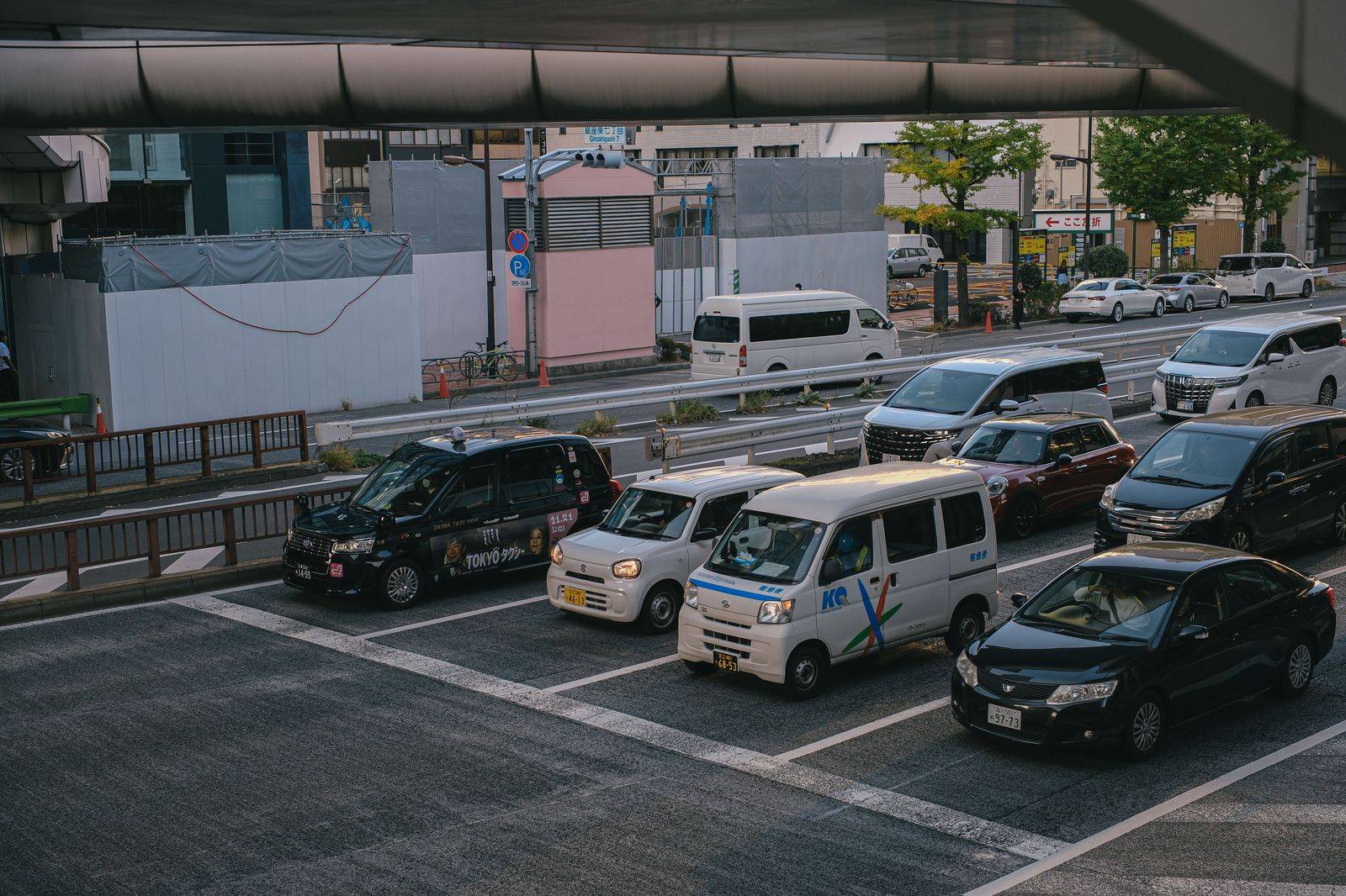 A full commuter parking lot on a weekday morning