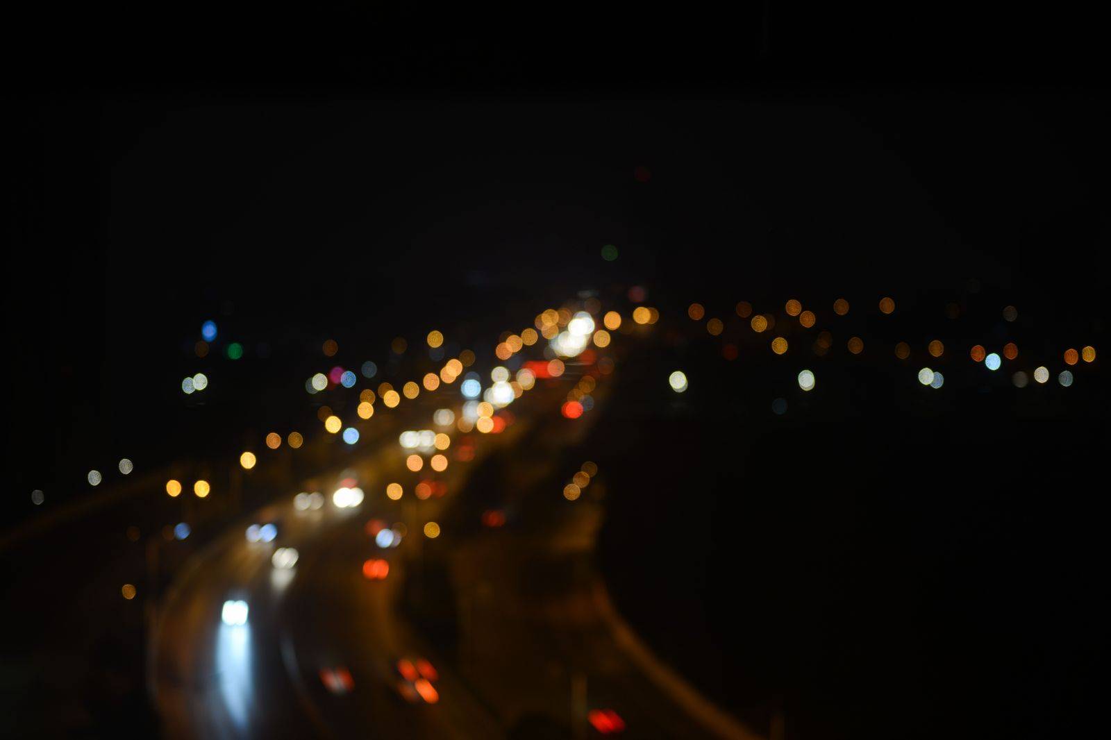 Headlights on a dark highway before dawn, the usual start for a Kingston to Pearson run