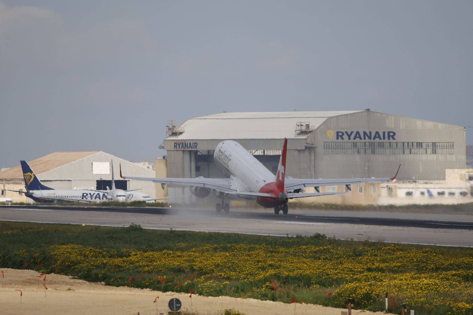 An airport departures board, the starting point for planning a London to Pearson pickup time