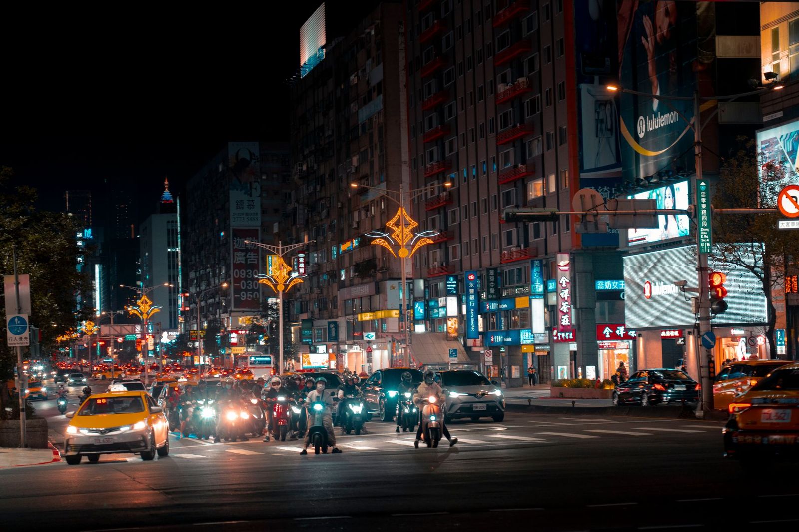 Front Street in downtown Toronto at night with traffic lights