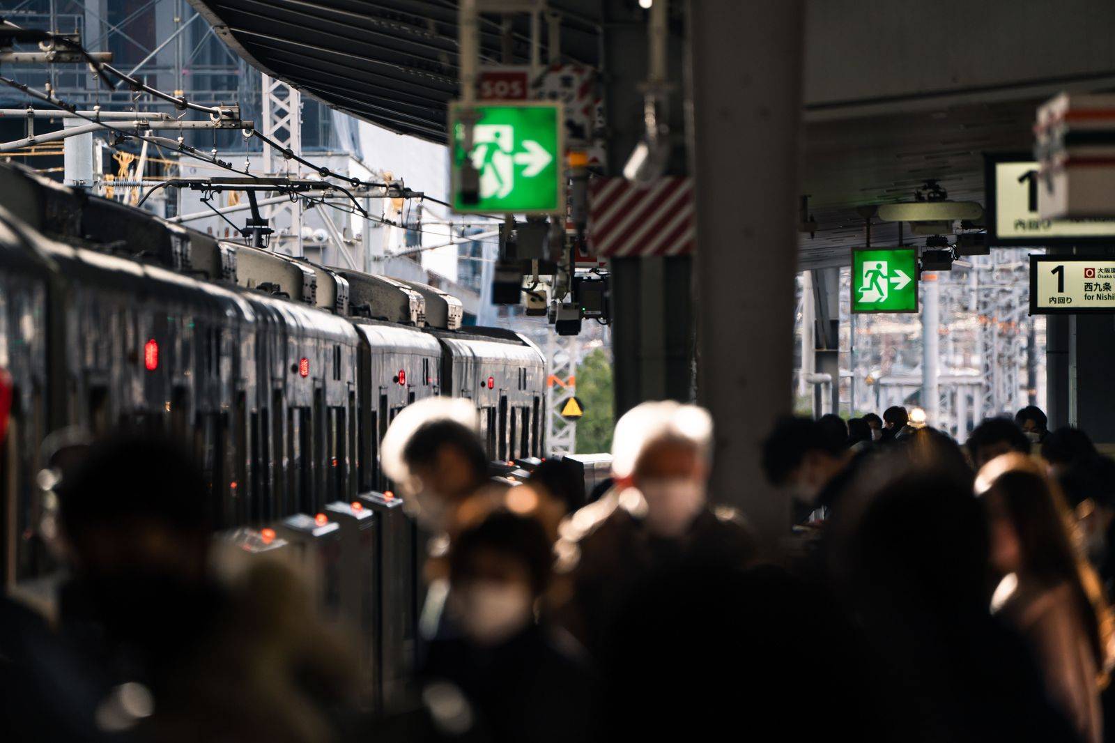 Commuters on a train platform during the morning rush