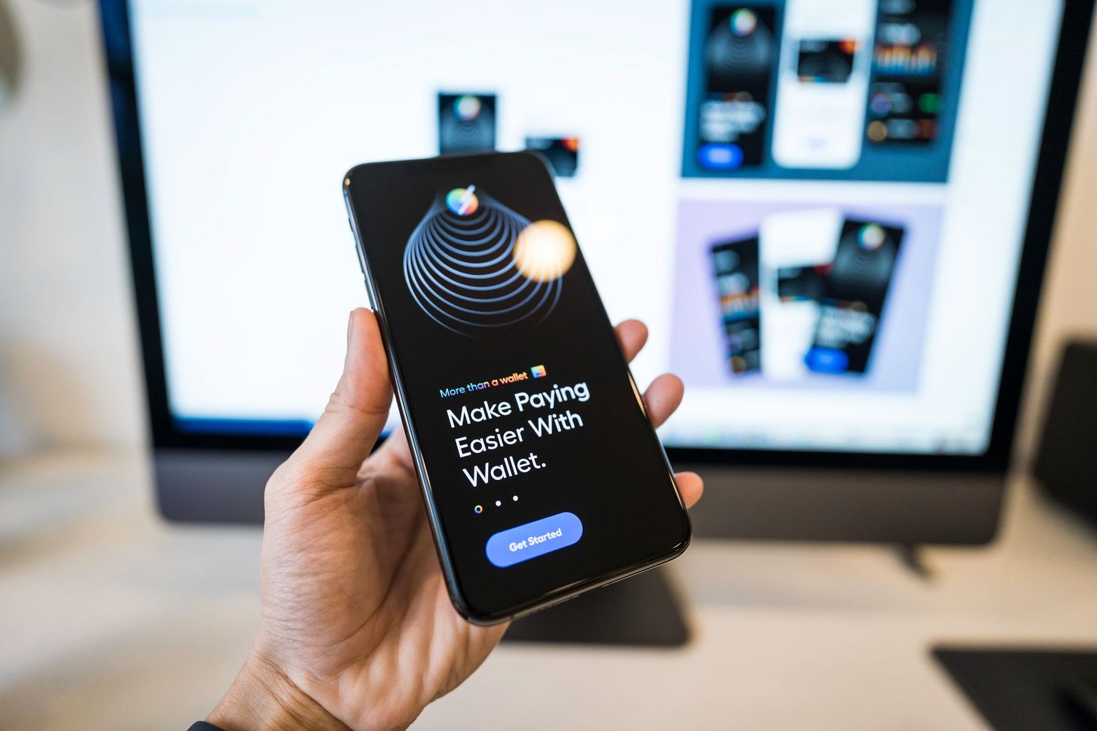A hand holds a smartphone to send a share of the party bus fare