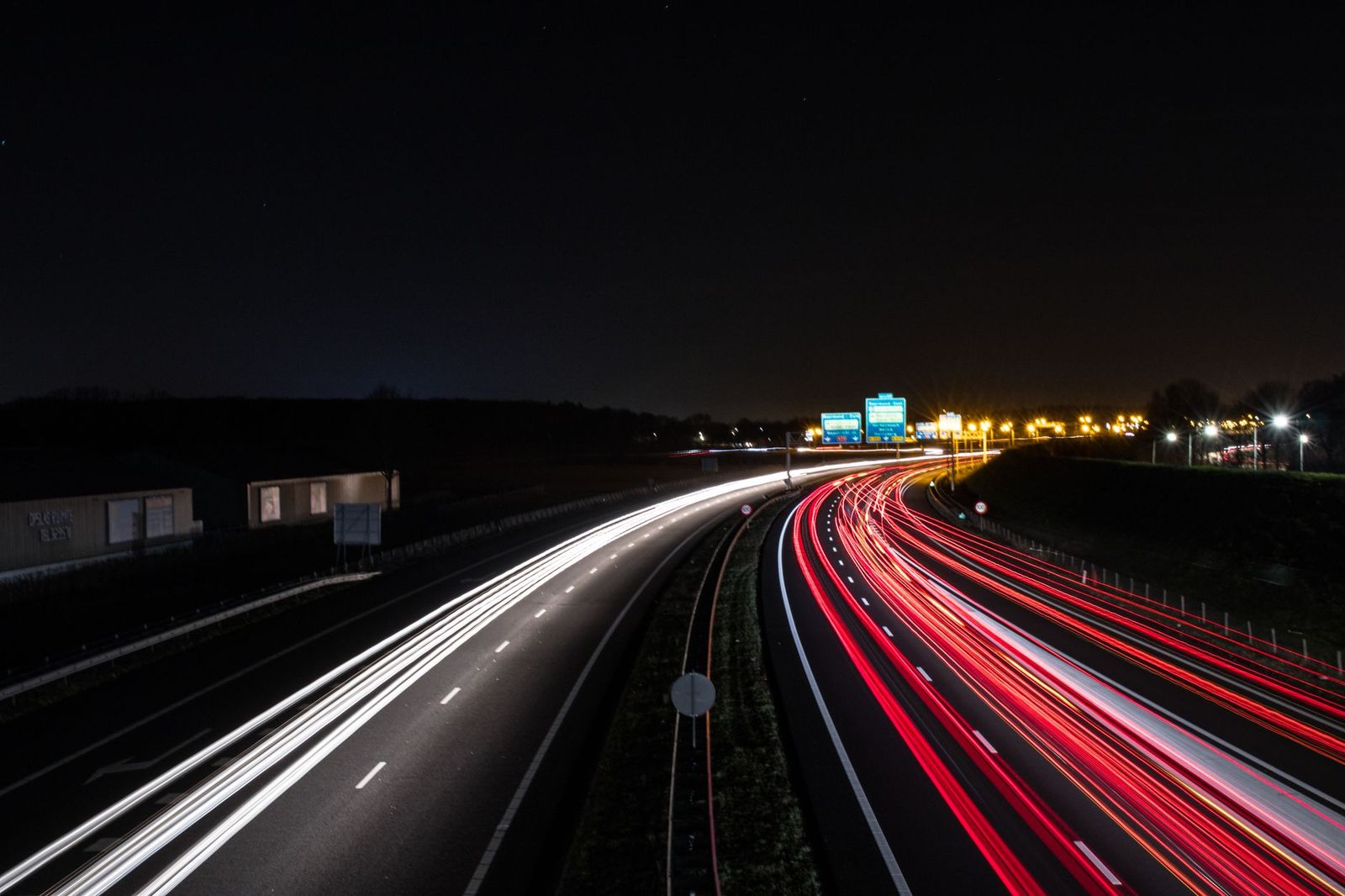 Light trails from evening traffic on a multi-lane highway heading east out of Toronto