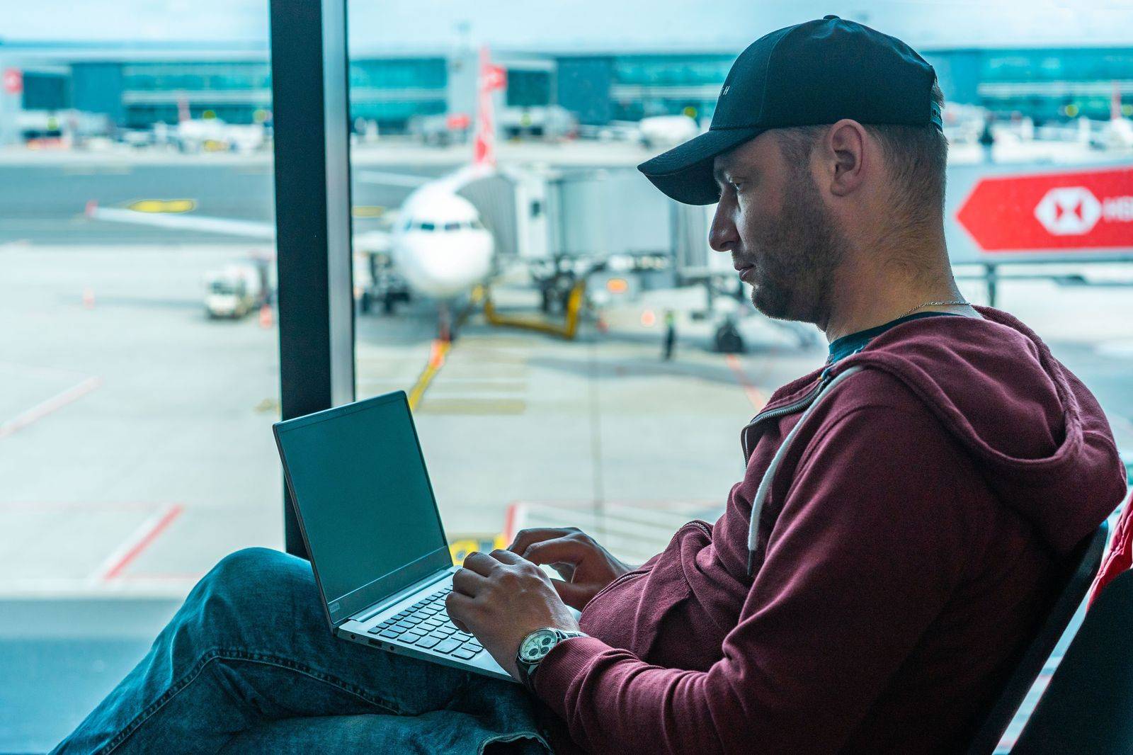 A business traveller working on a laptop before a short-haul flight