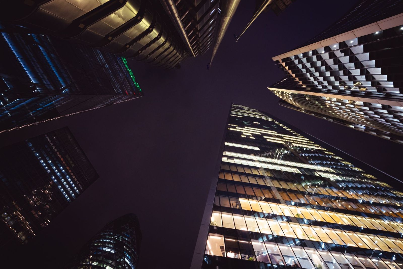 The glass facade of a downtown Toronto concert hall lit at night