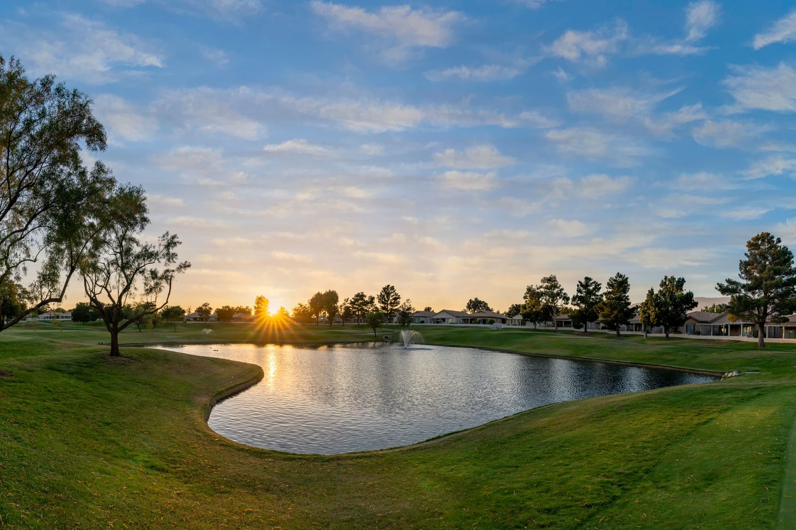 A golf course beside a lake in Muskoka