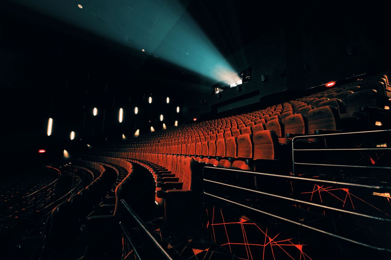 Cinema seats in front of a dark screen before a festival screening