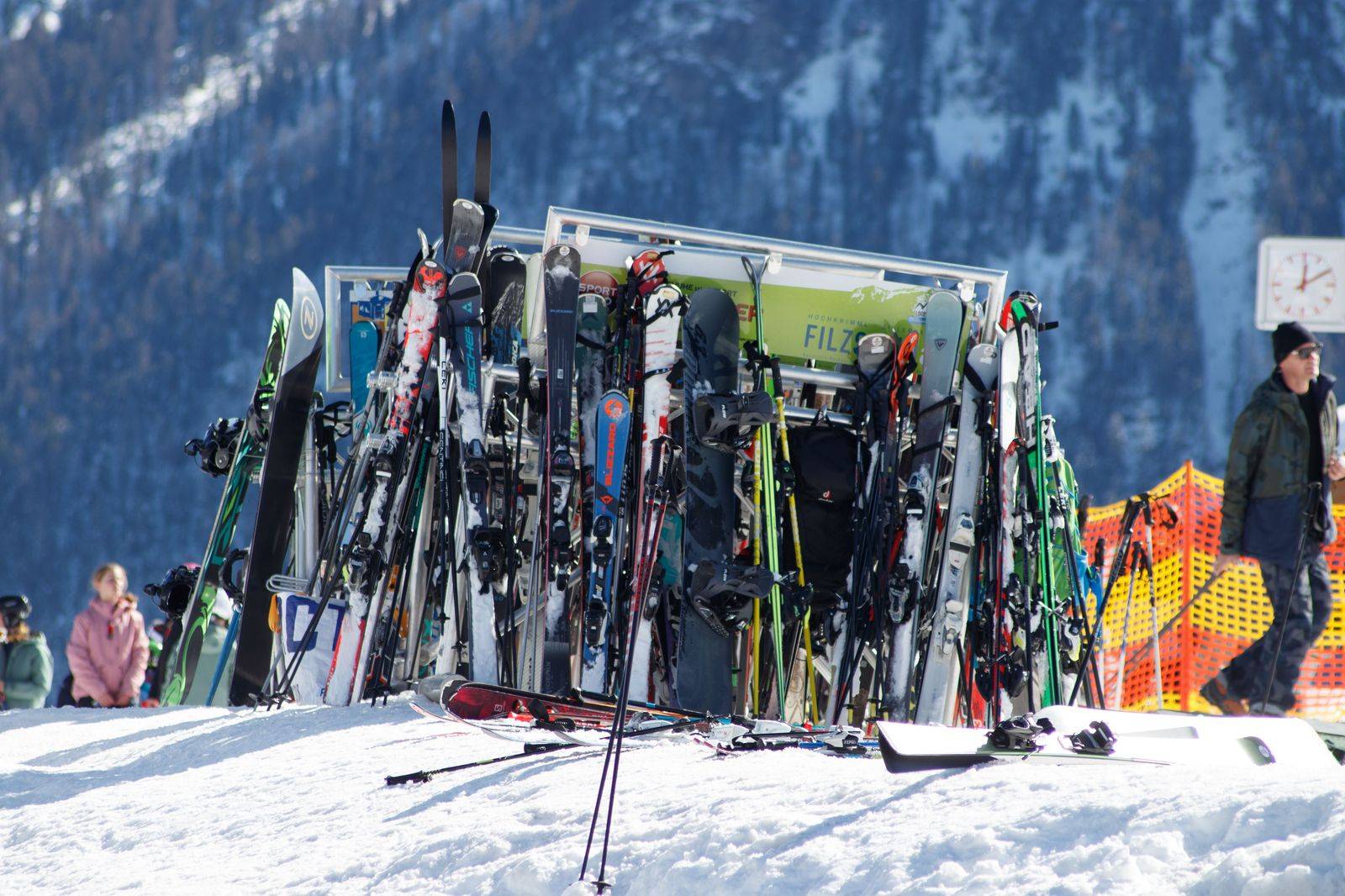Ski bags and luggage loaded into the back of a large black SUV