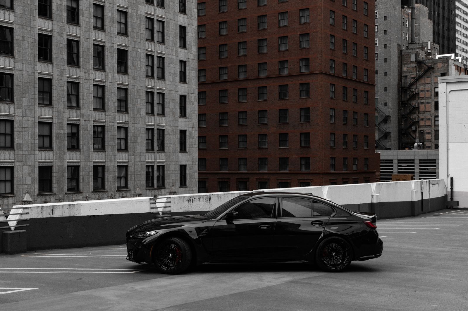 A black sedan waiting outside a Toronto office tower during an hourly booking