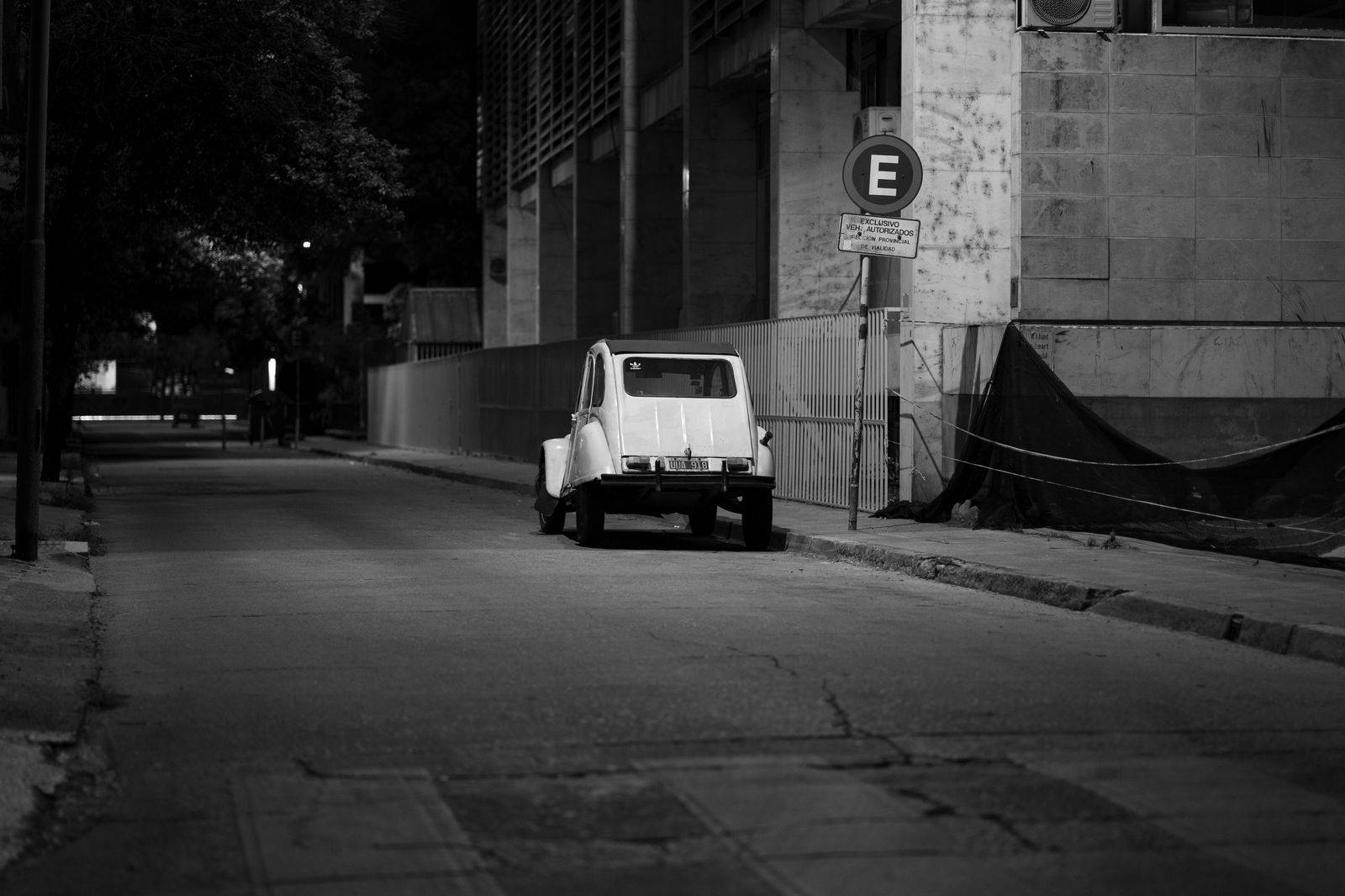 A chauffeur waiting at a legal stopping spot near Union Station after dark