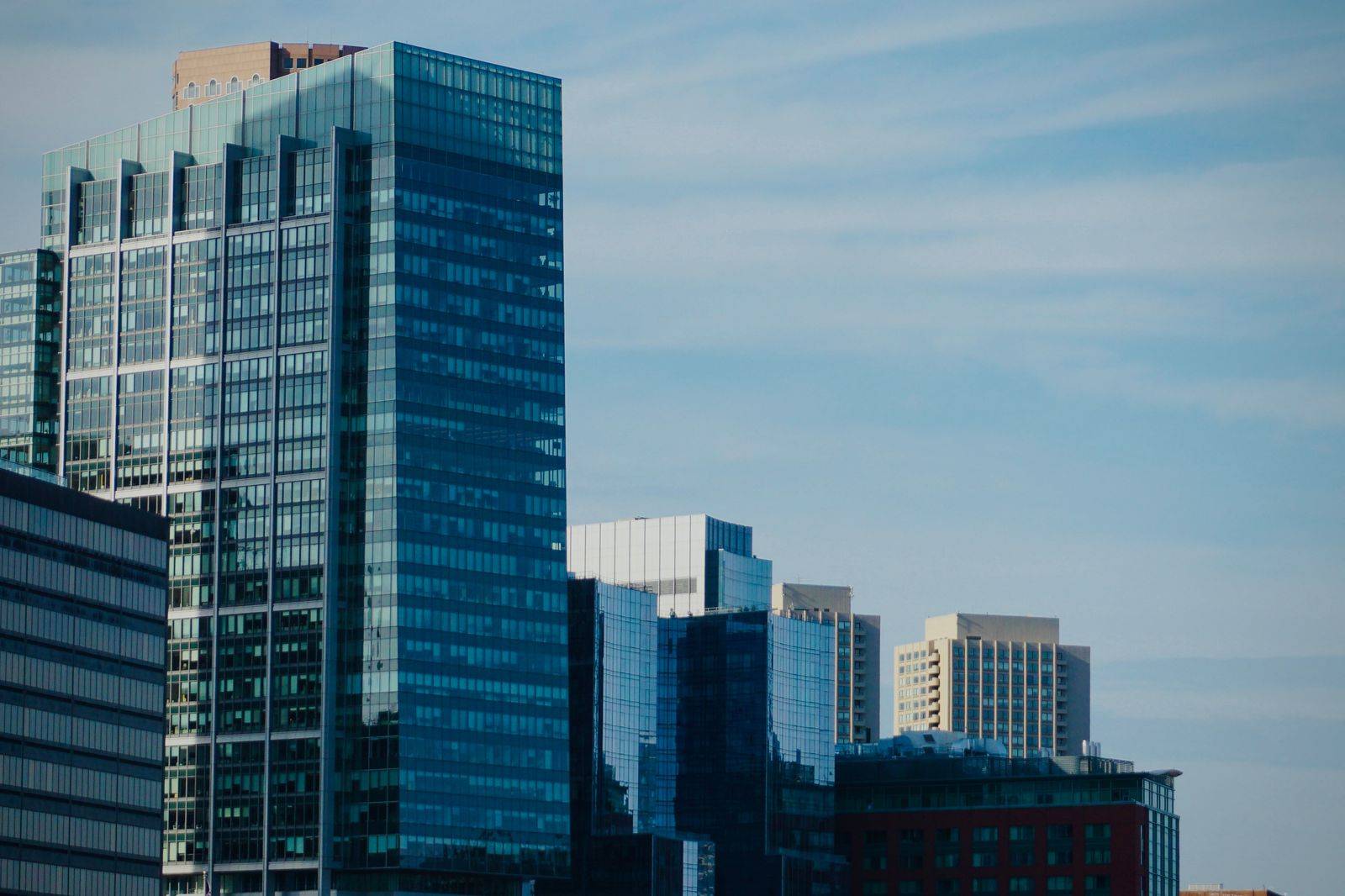 Glass office towers rising in a suburban city centre