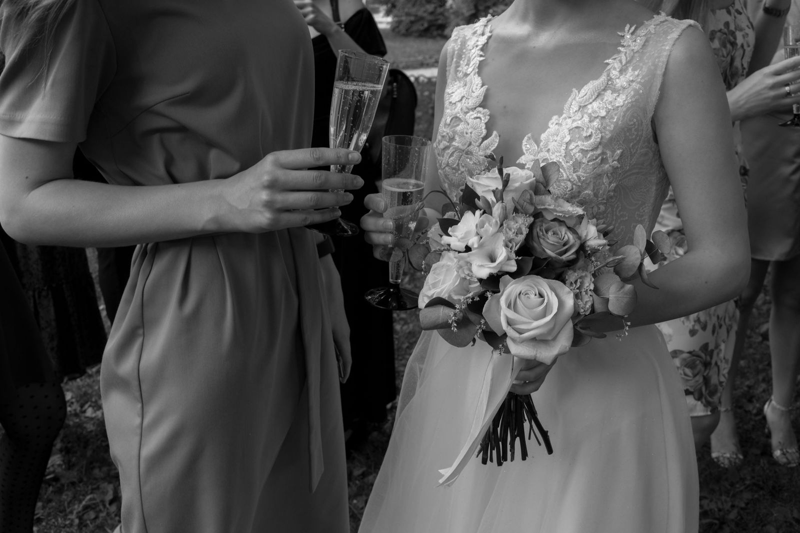 Wedding guests gather beside a black limousine outside a Toronto reception venue