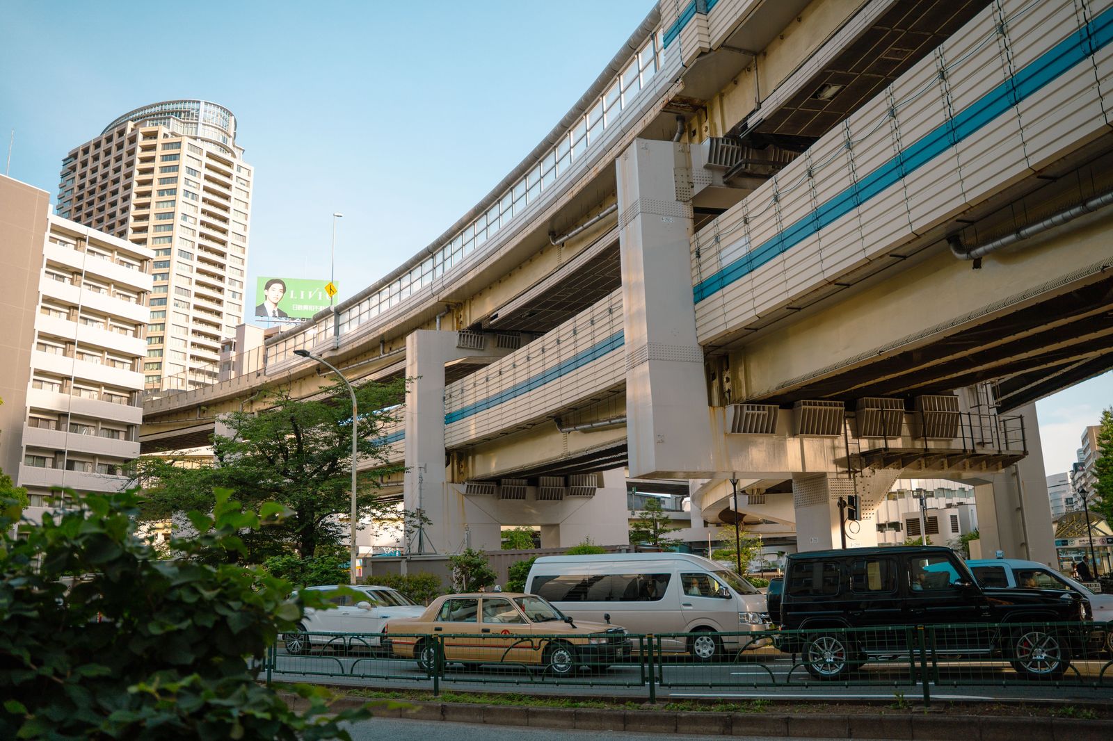 Elevated expressway traffic beside the lake in a big city