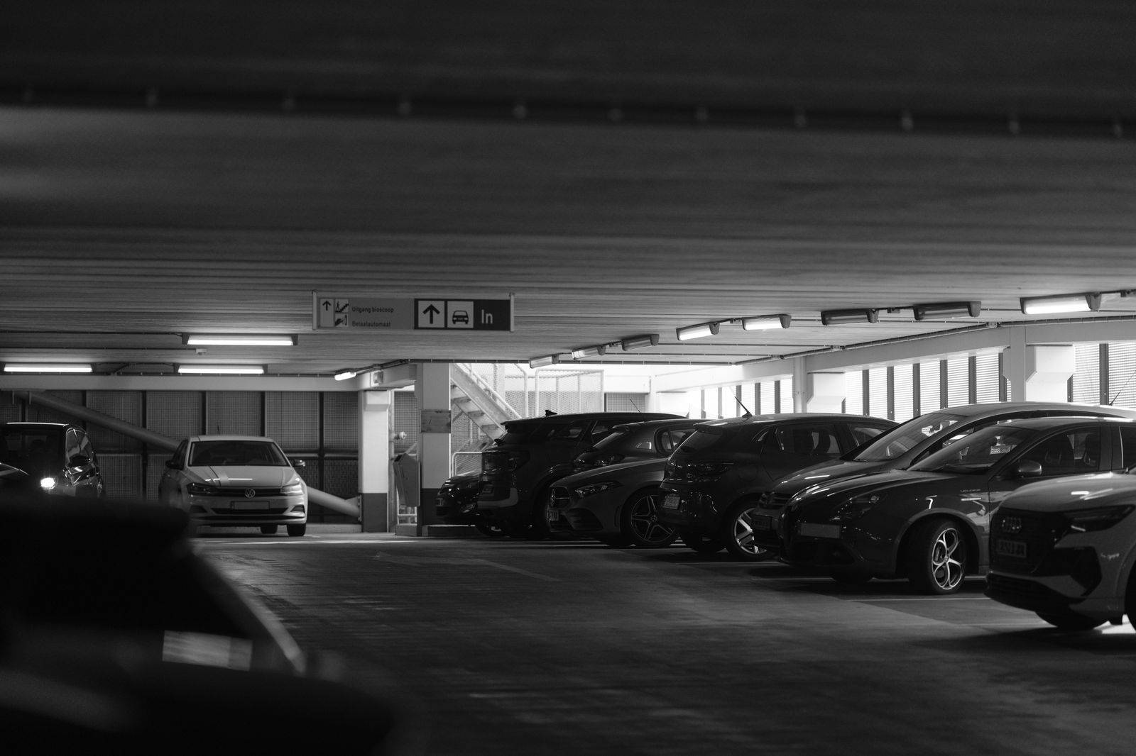 Rows of parked cars in a garage, the cost that grows with every night away