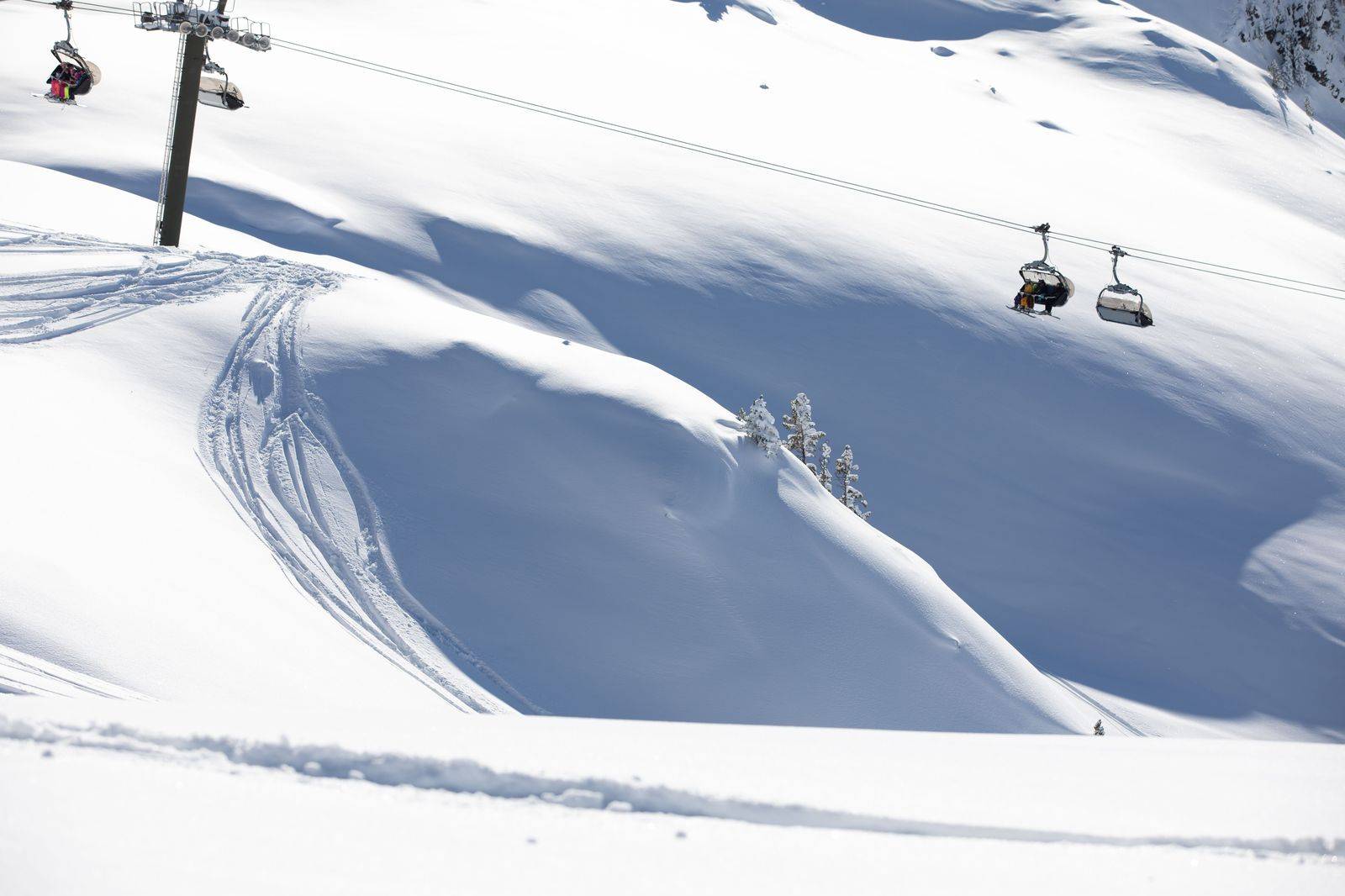 A chairlift above snowy slopes north of Barrie, a regular ski-weekend drop for our SUVs