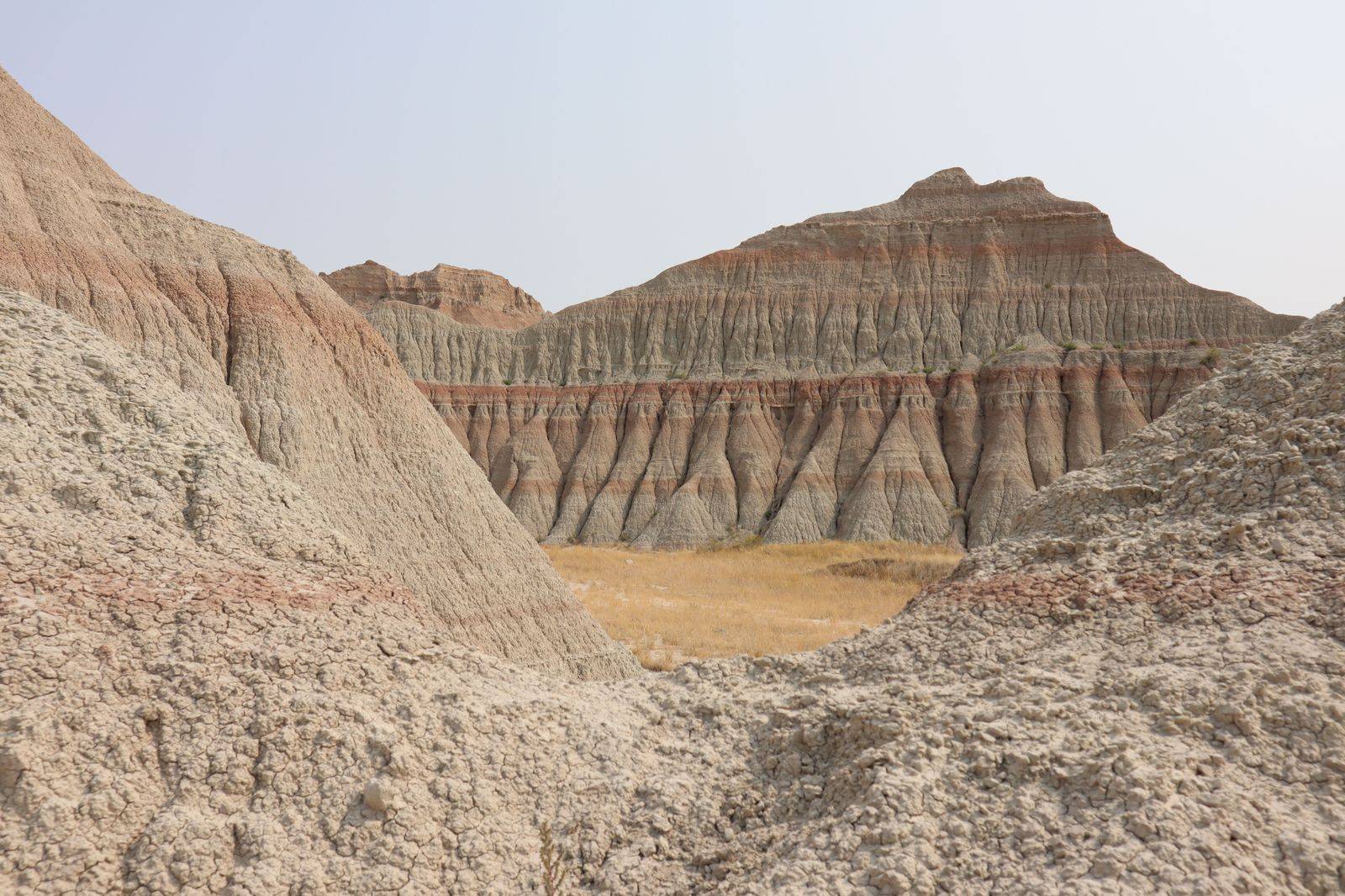 Eroded red shale hills of a badlands landscape