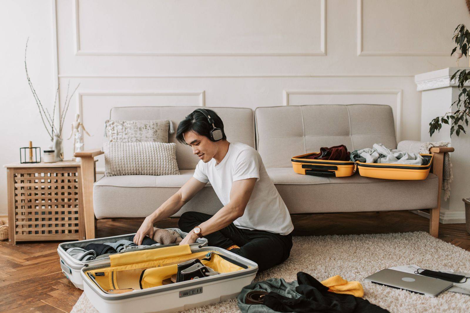 A chauffeur loading a suitcase into the trunk before an early-morning drive from Northumberland to Pearson