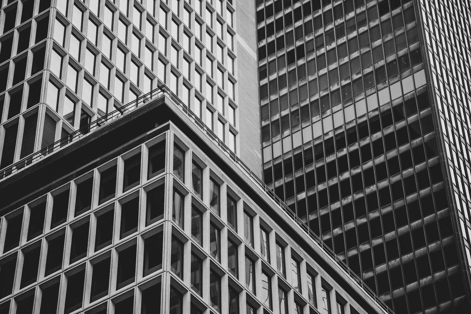 A black business sedan waiting outside a Financial District office tower for an afternoon run to Pearson