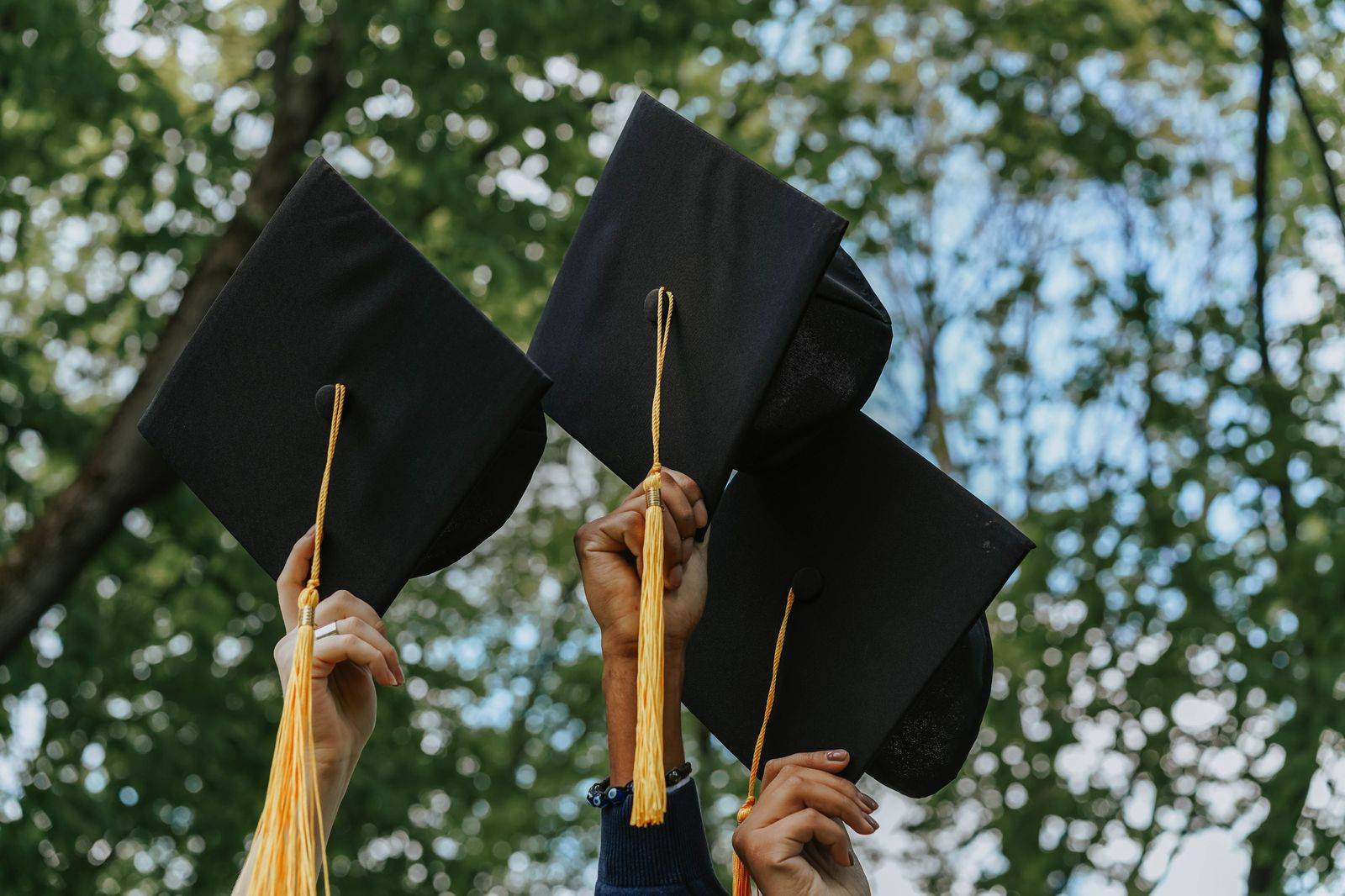 Graduates throwing caps in the air, the convocation weekends that bring families from Toronto to Kingston