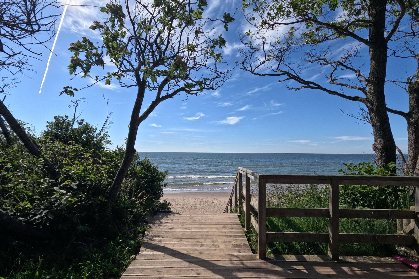 A lakefront boardwalk and beach on Lake Ontario
