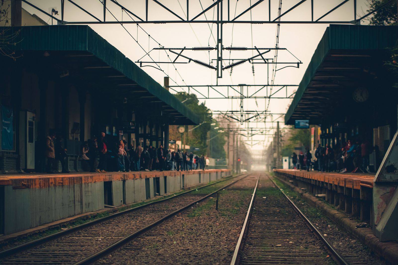 A commuter train platform in the early morning