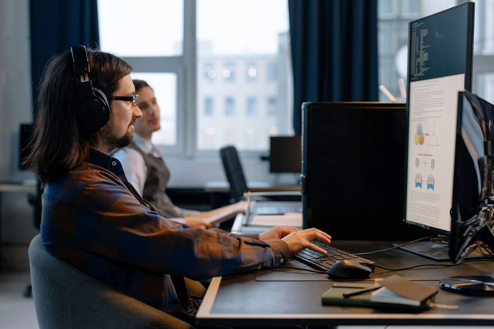 Dispatcher with a headset watching live bookings for Toronto chauffeured trips