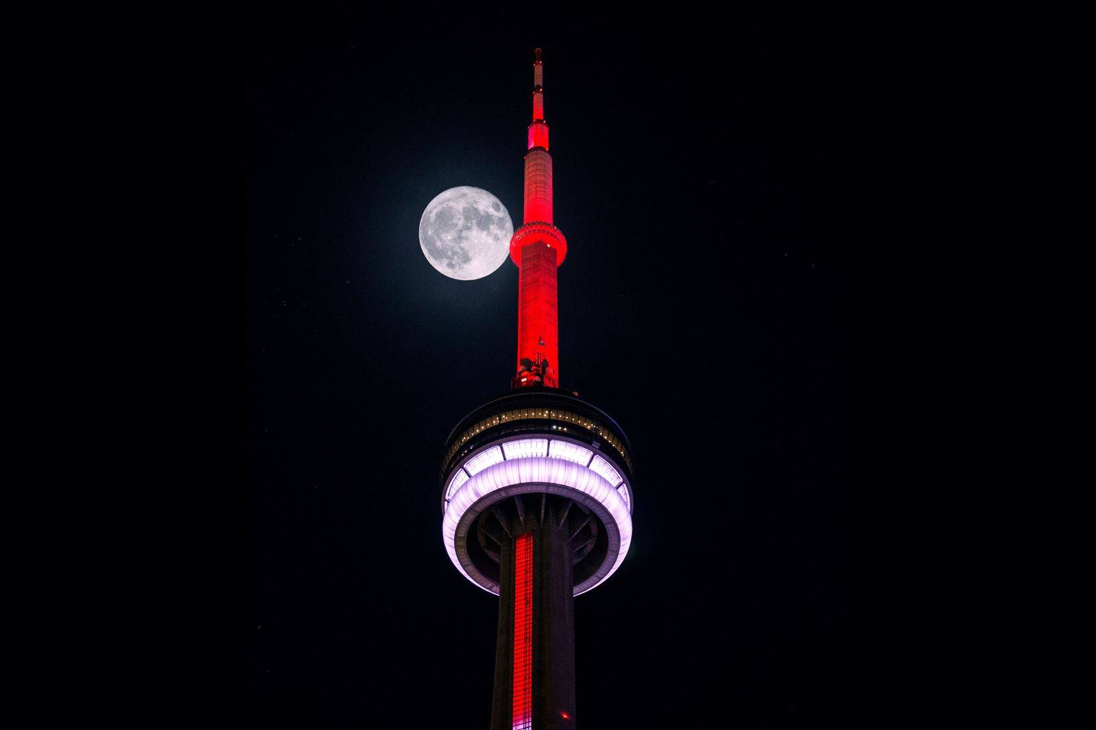 Toronto skyline and CN Tower at night, seen on an evening chauffeured drive