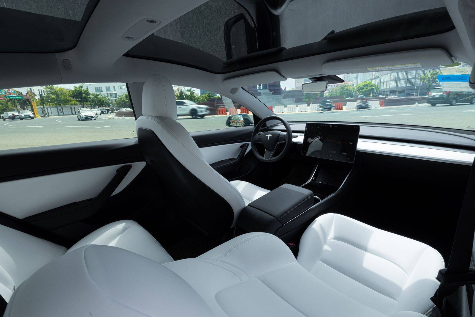 Passenger in the back seat of a Toronto black car on a fixed-fare airport transfer
