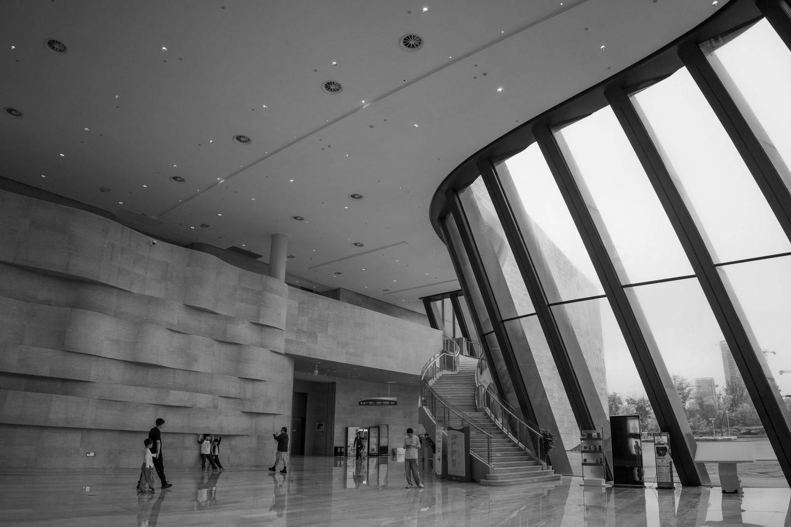 Visitors walking through a convention centre lobby on a busy show day