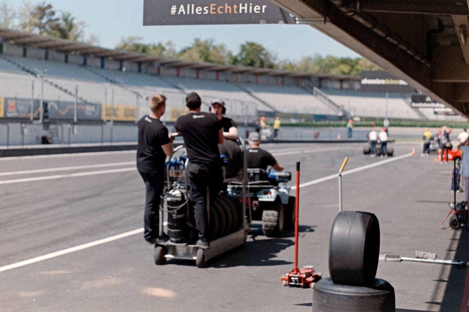 Pit lane crew at work during an IndyCar race weekend