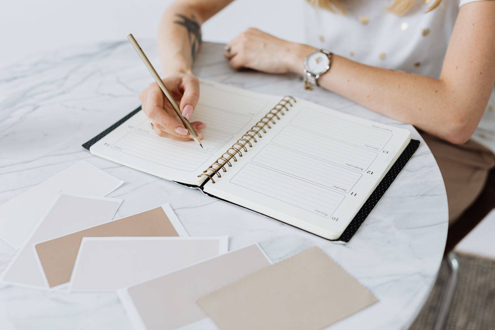 A wedding planner's timeline laid out with ceremony, photos and reception times