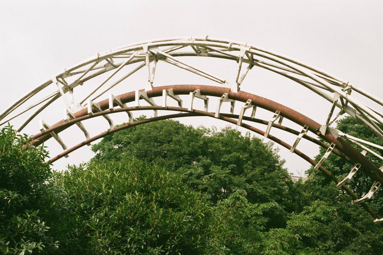 A roller coaster at an amusement park on a summer day