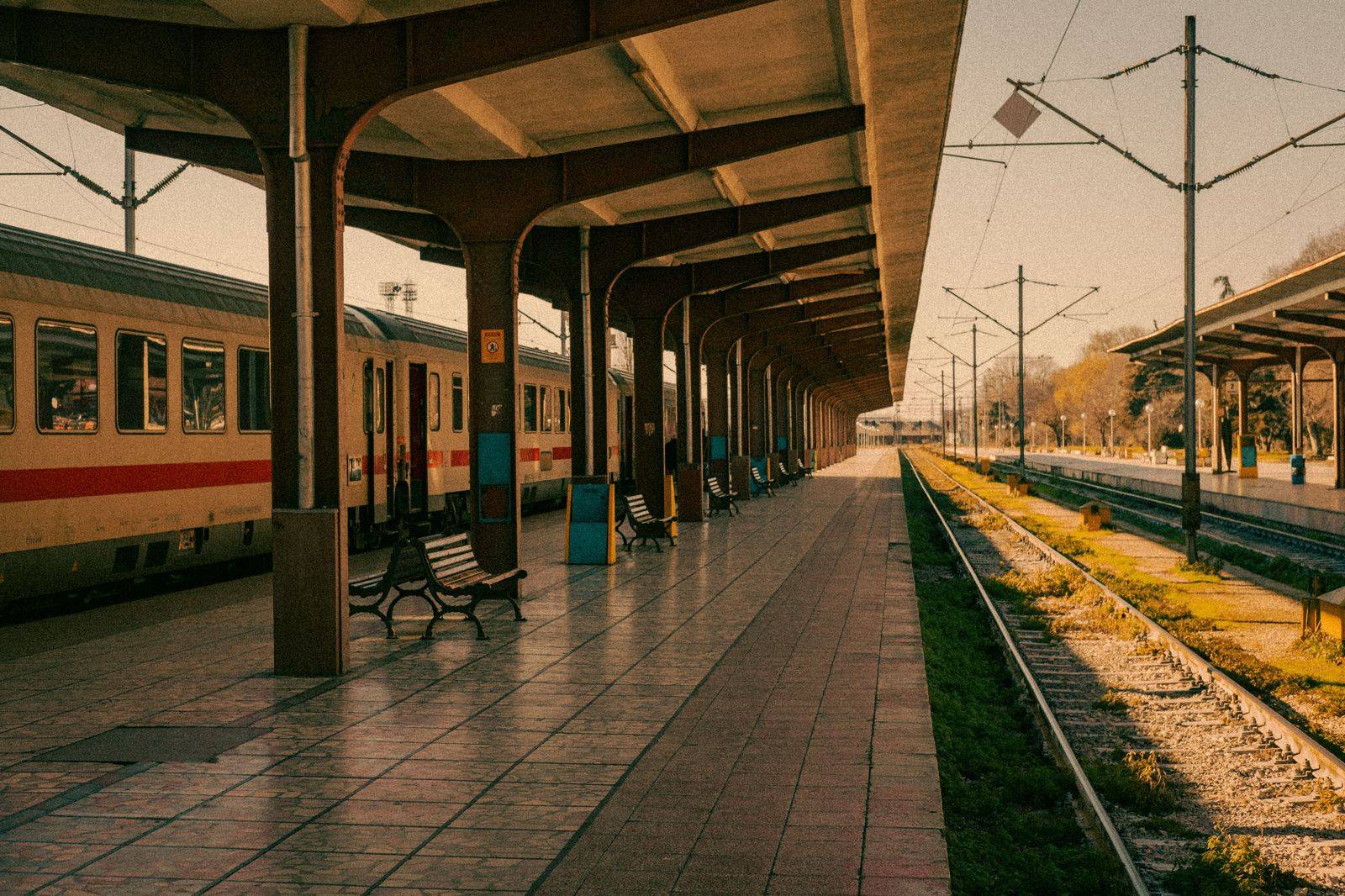 A commuter train at a suburban platform, like Oakville's GO and VIA station