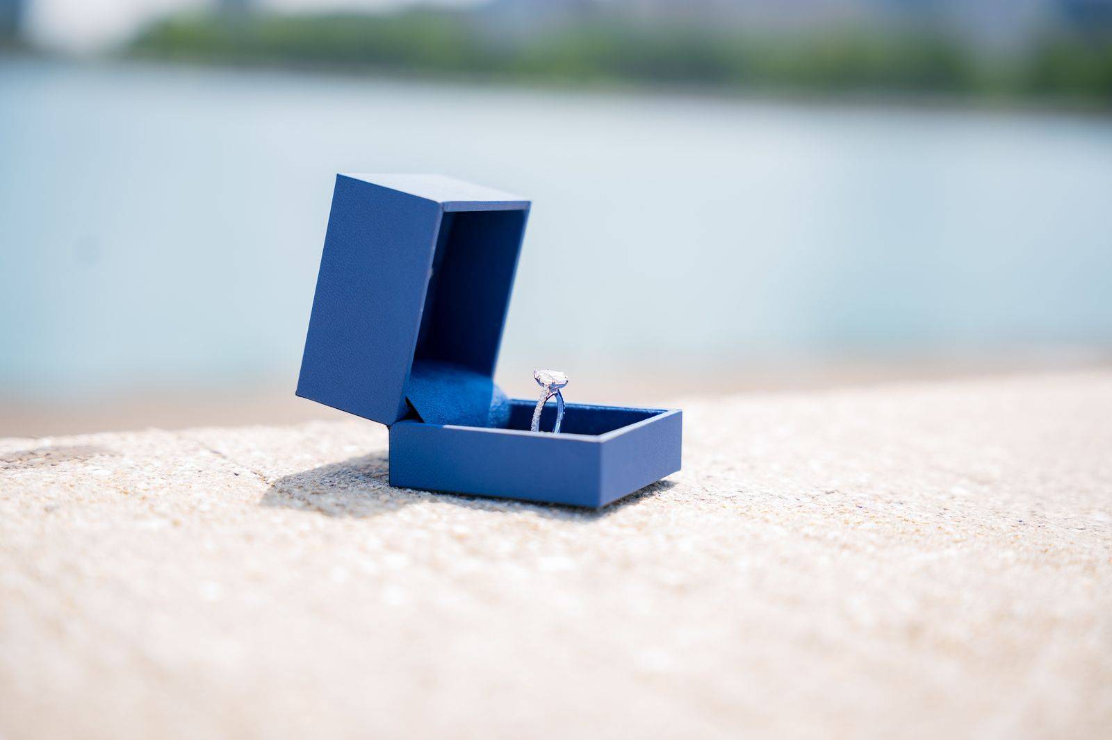 An engagement ring box held ready before a proposal planned with a Toronto chauffeur