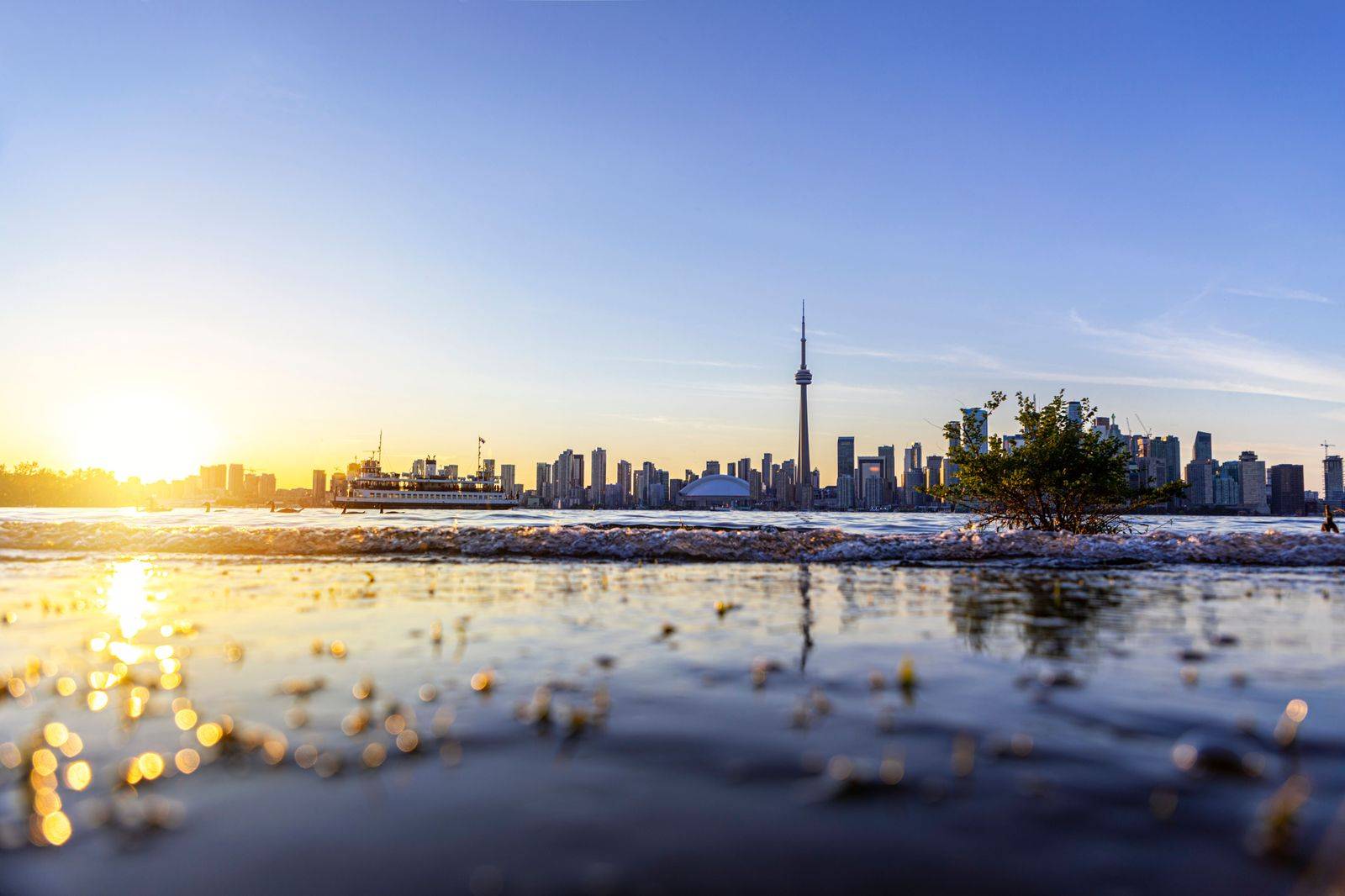 Toronto skyline at sunset seen from the waterfront on a chauffeured date night